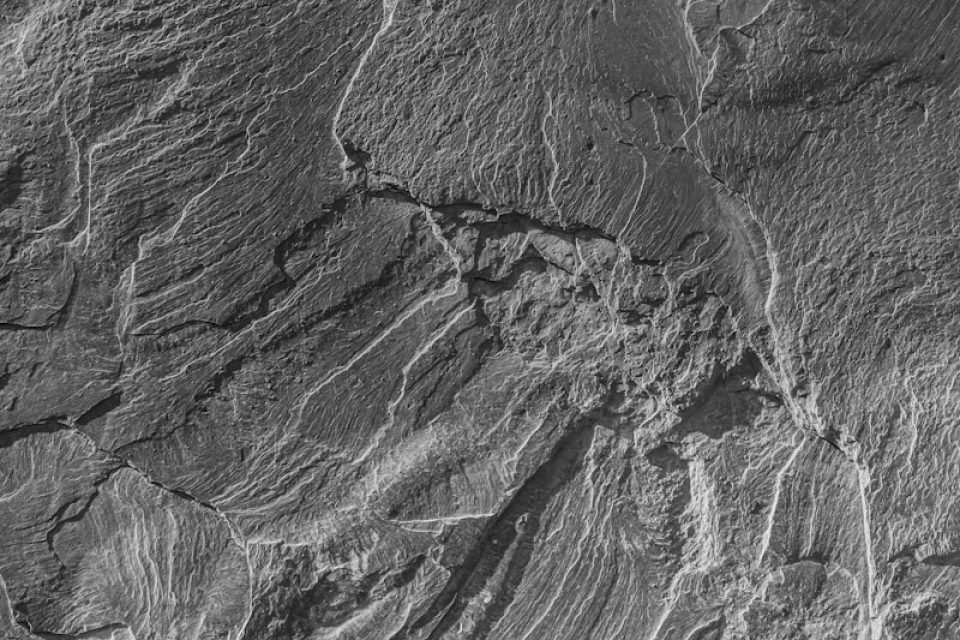 grayscale photo of rock formation